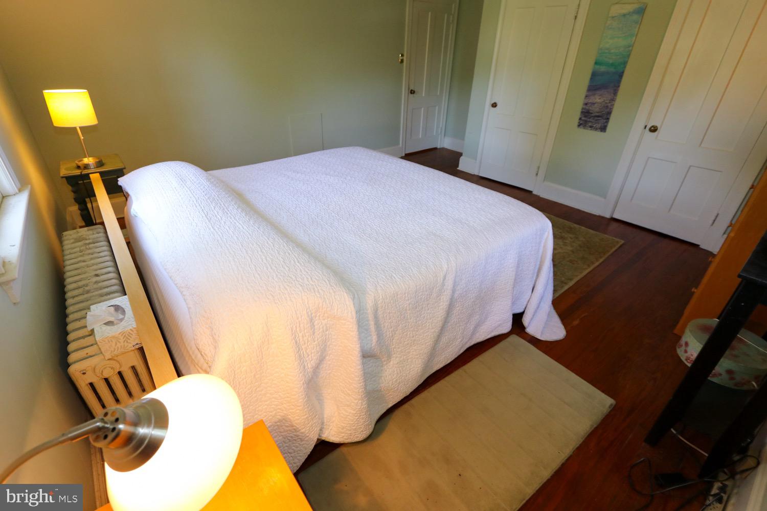 2701 Alden Road Bryn Athyn, PA 19006 - Photo 69 of 105 a bedroom with a bed and wooden floor