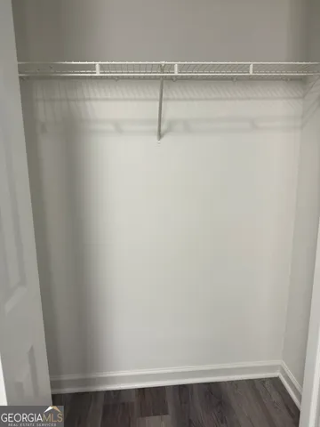 a view of front door with wooden floor