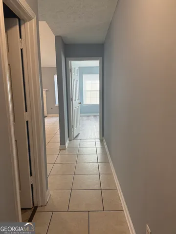 a view of a livingroom with furniture and a window