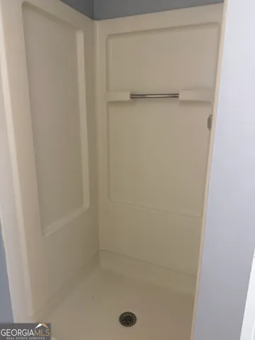 a bathroom with a sink toilet and a mirror