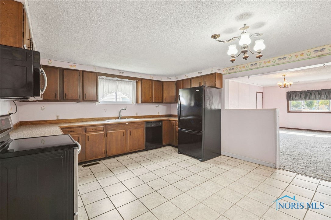 9097 Custar Road Custar, OH 43511 - Photo 7 of 26 Kitchen & Family Room view