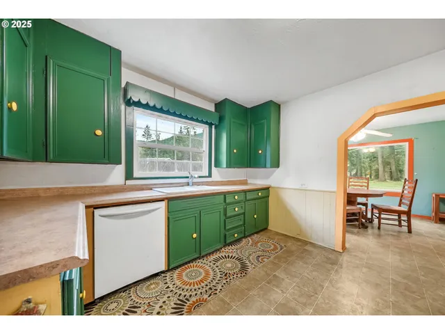a kitchen with sink and cabinets