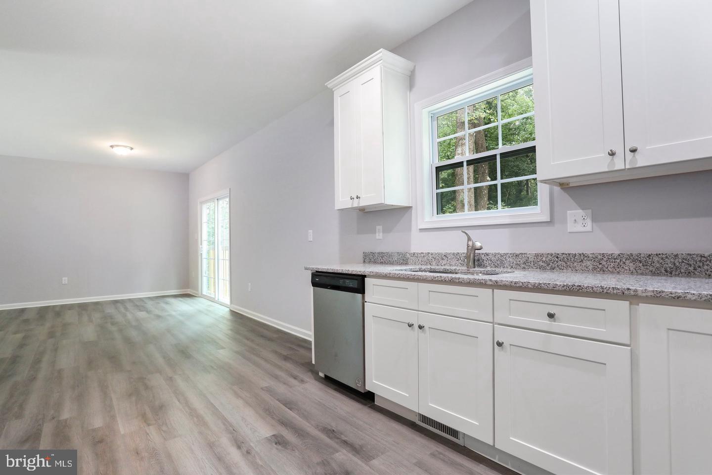 Plum Tree Lane Berkeley Springs, WV 25411 - Photo 5 of 18 an empty room with granite countertop cabinets and window