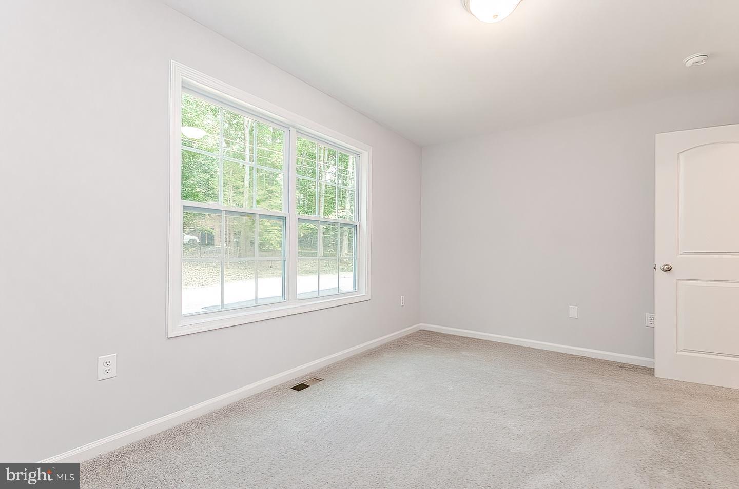 Plum Tree Lane Berkeley Springs, WV 25411 - Photo 8 of 18 an empty room with a window