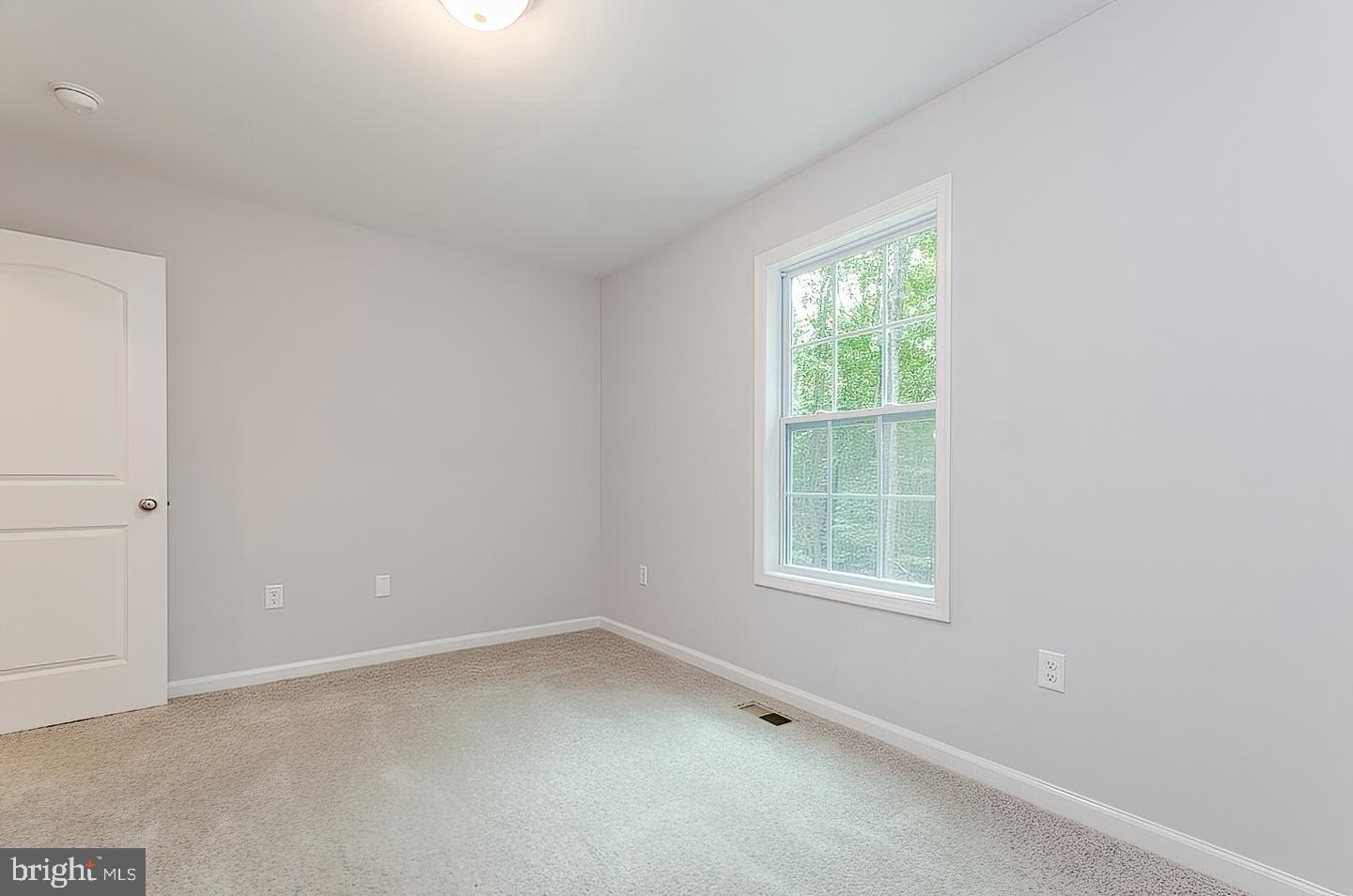 Plum Tree Lane Berkeley Springs, WV 25411 - Photo 9 of 18 an empty room with a window