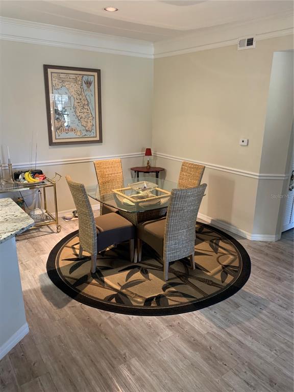 5134 Northridge Road, Unit 204 Sarasota, FL 34238 - Photo 13 of 21 a view of a dining room with a table and chairs