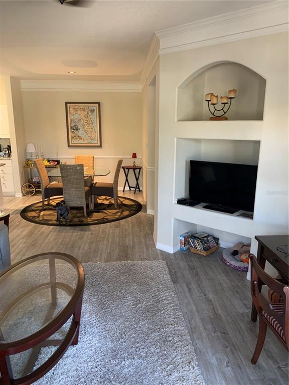 5134 Northridge Road, Unit 204 Sarasota, FL 34238 - Photo 19 of 21 a living room with furniture and a fireplace