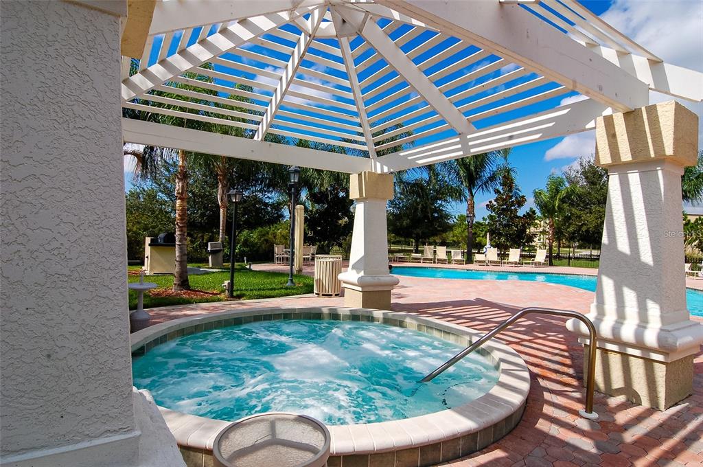 5134 Northridge Road, Unit 204 Sarasota, FL 34238 - Photo 5 of 21 a view of a house with a yard patio and a garden