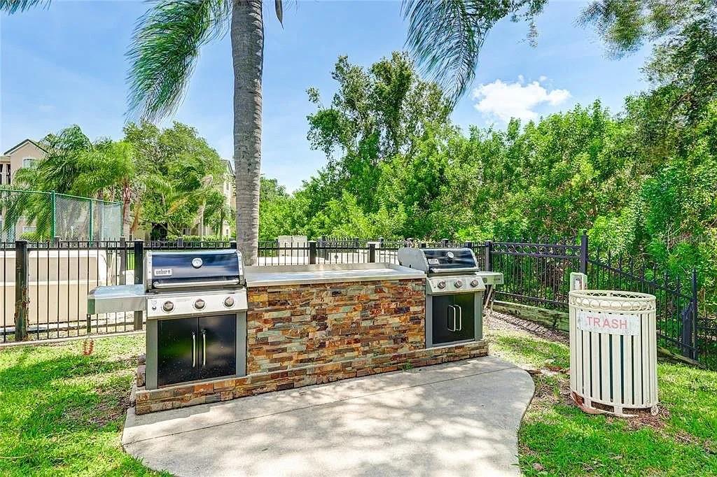5134 Northridge Road, Unit 204 Sarasota, FL 34238 - Photo 10 of 21 a view of a dinning table and chairs in the garden