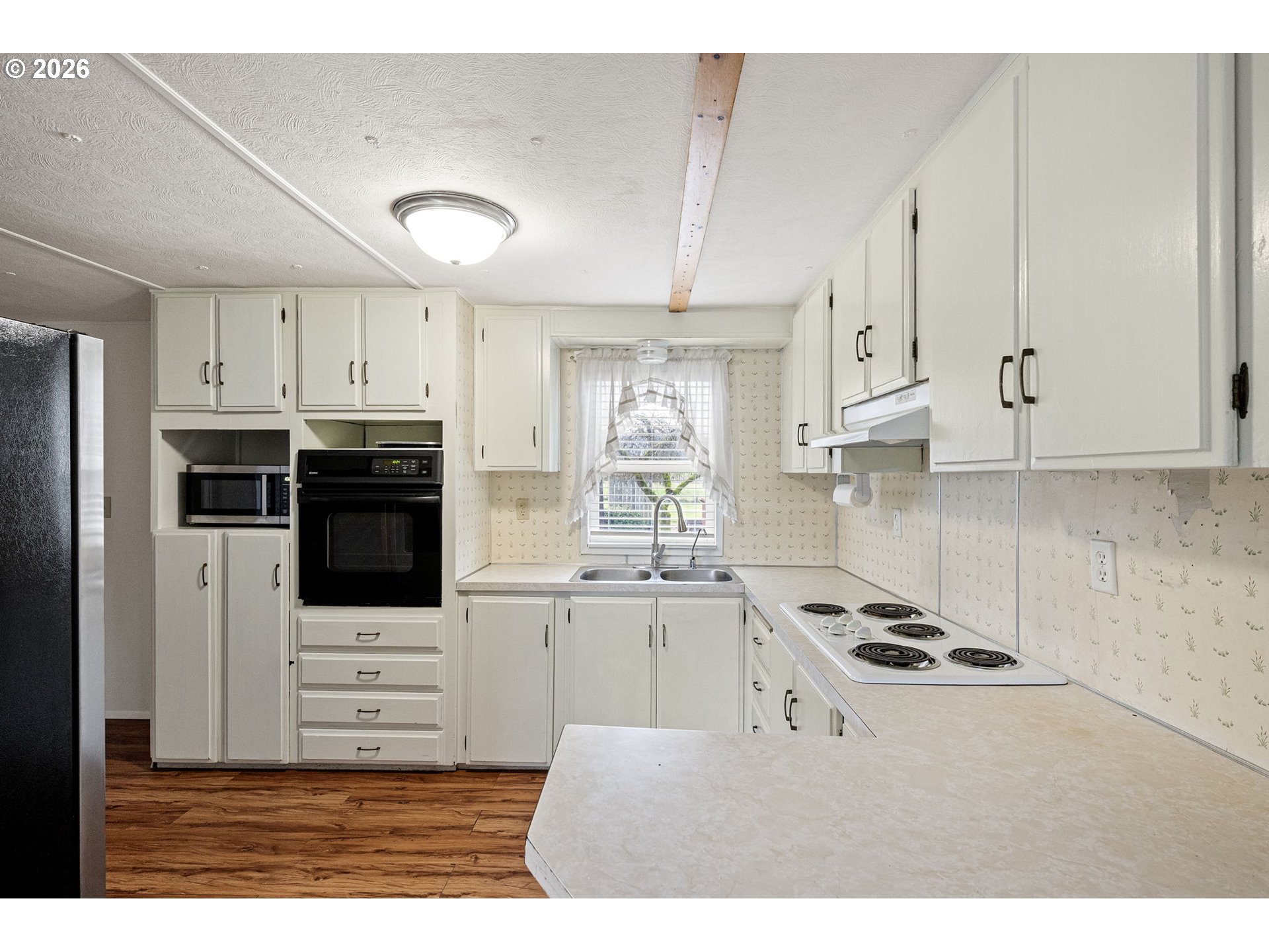 82073 Lost Creek Road Dexter, OR 97431 - Photo 17 of 47 a kitchen with stainless steel appliances kitchen island granite countertop a stove a sink and a refrigerator