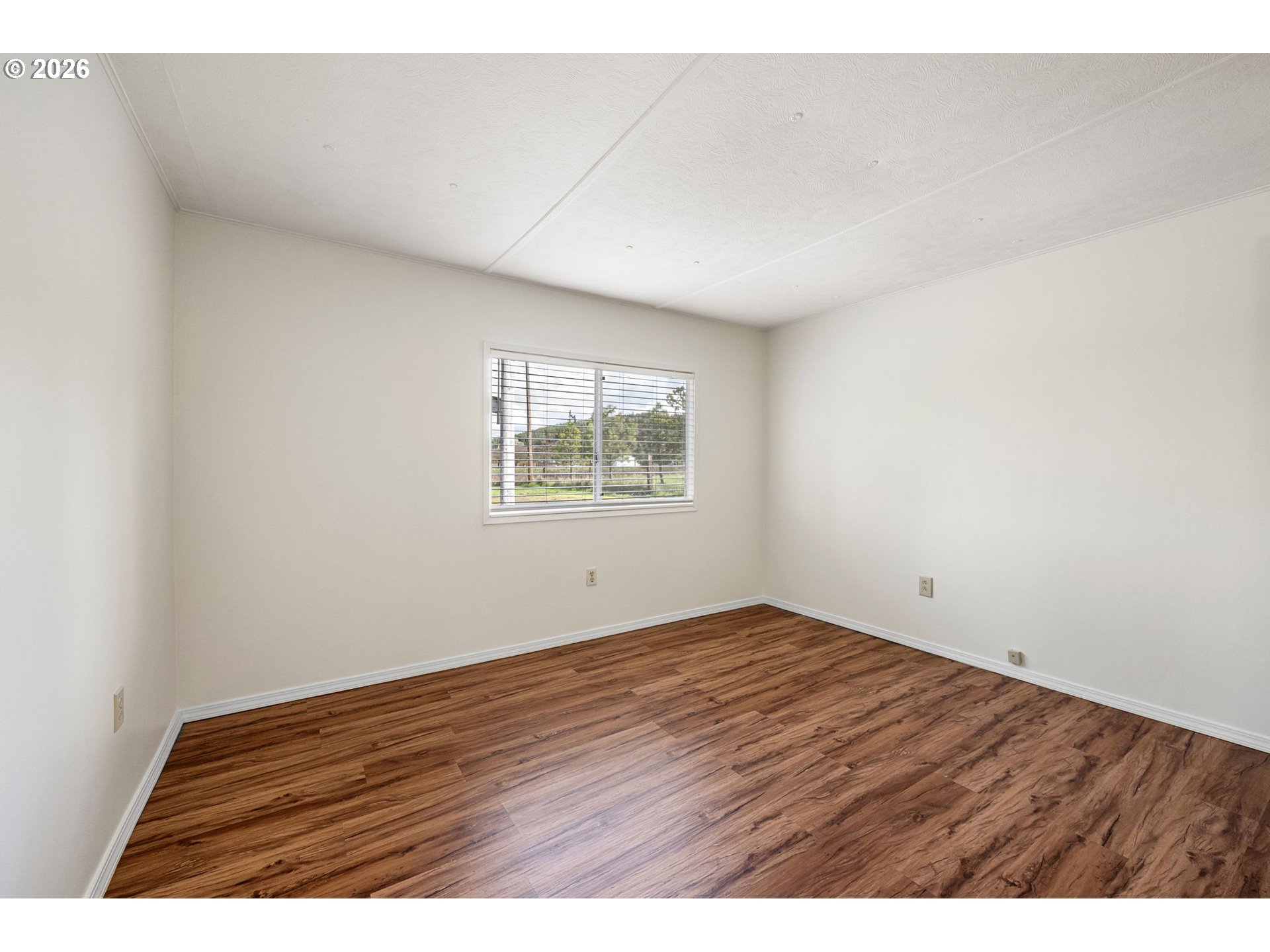 82073 Lost Creek Road Dexter, OR 97431 - Photo 26 of 47 an empty room with wooden floor and windows
