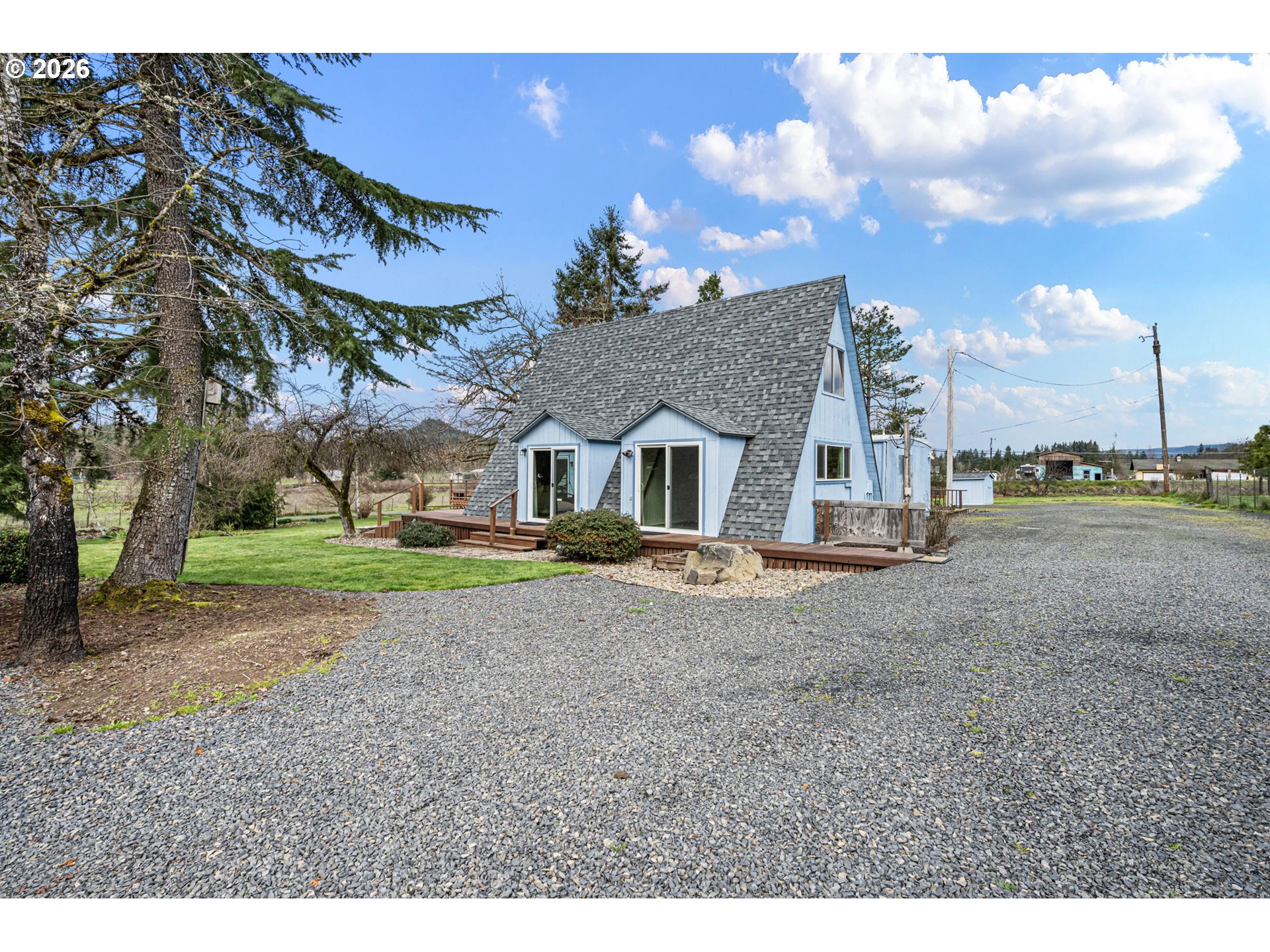 82073 Lost Creek Road Dexter, OR 97431 - Photo 5 of 47 a view of a house with a yard