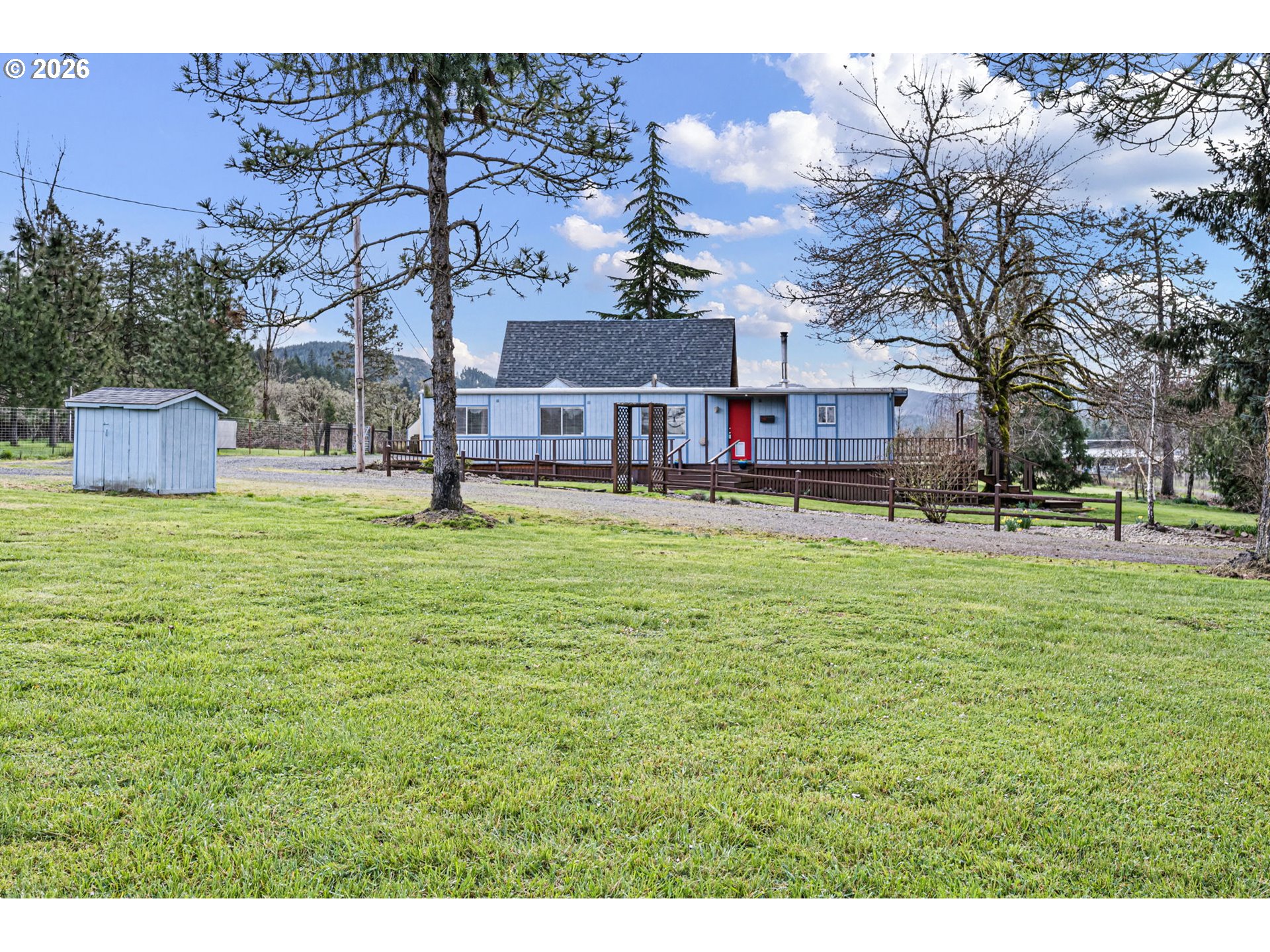 82073 Lost Creek Road Dexter, OR 97431 - Photo 7 of 47 a house view with swimming pool and trees in the background