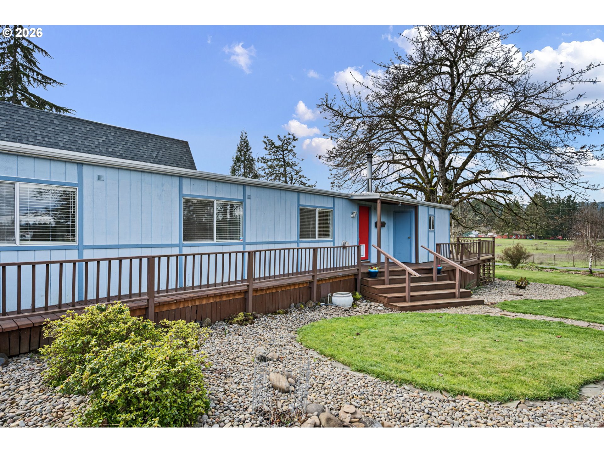 82073 Lost Creek Road Dexter, OR 97431 - Photo 9 of 47 a front view of a house with garden and patio