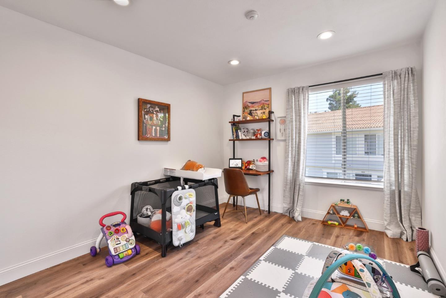 4966 Bridgepointe Place Union City, CA 94587 - Photo 15 of 19 a living room with furniture a rug and a window