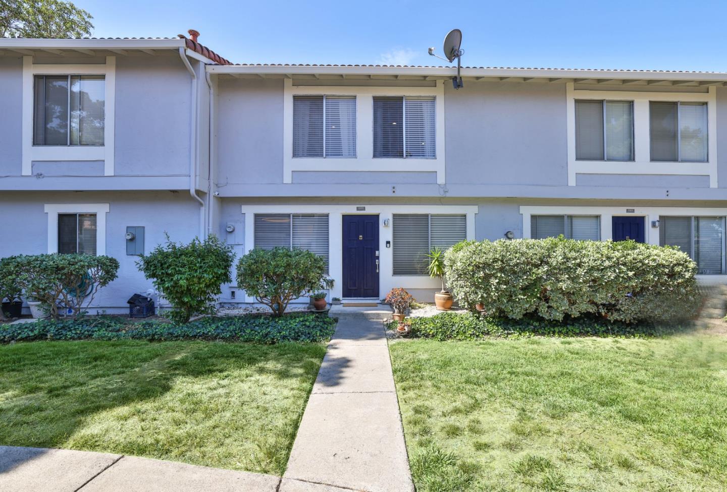 4966 Bridgepointe Place Union City, CA 94587 - Photo 2 of 19 a front view of a house with garden