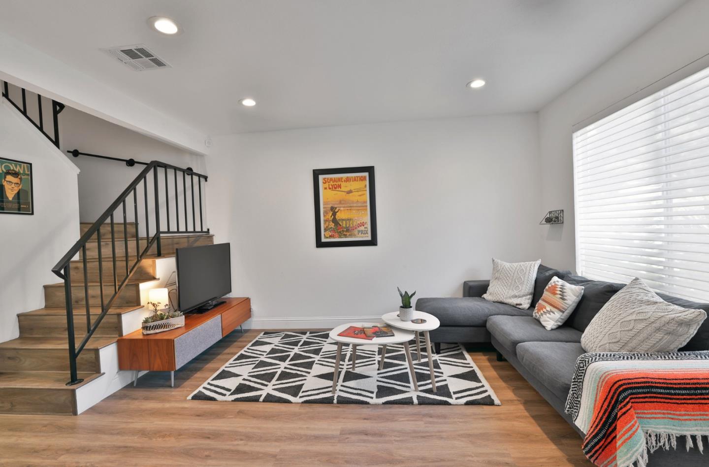 4966 Bridgepointe Place Union City, CA 94587 - Photo 6 of 19 a living room with furniture rug and wooden floor