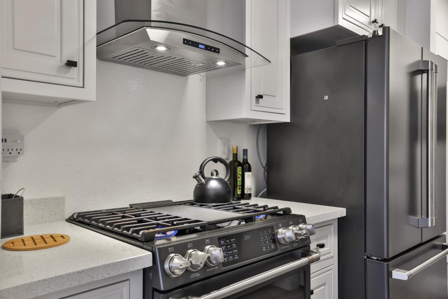 4966 Bridgepointe Place Union City, CA 94587 - Photo 9 of 19 a stove top oven sitting inside of a kitchen