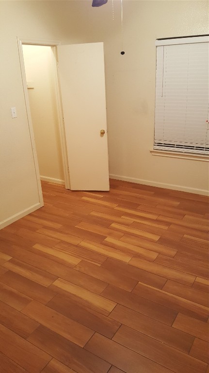 2808 Southampton Way, Unit A Round Rock, TX 78664 - Photo 14 of 16 a view of an empty room with wooden floor