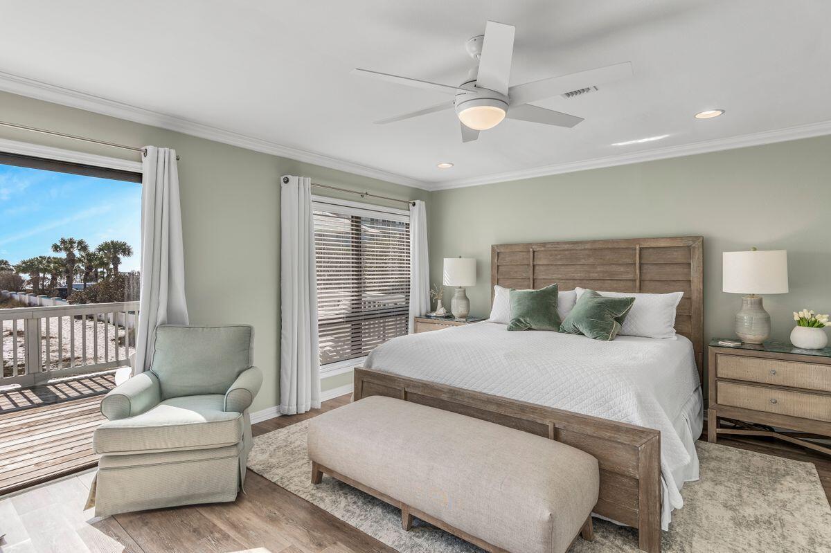 320 Gulf Shore Drive Destin, FL 32541 - Photo 18 of 46 a bedroom with a large bed and a couch