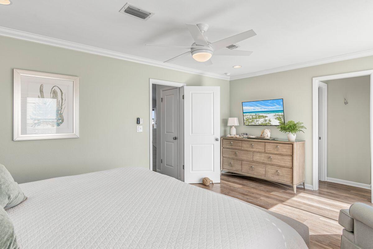 320 Gulf Shore Drive Destin, FL 32541 - Photo 19 of 46 a bedroom with a bed and a cabinets