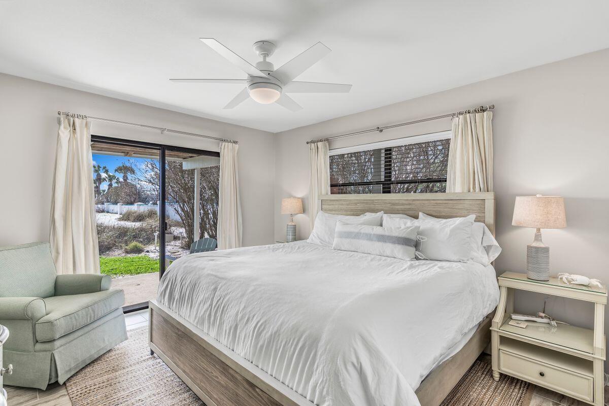 320 Gulf Shore Drive Destin, FL 32541 - Photo 20 of 46 a bedroom with a large bed and a couch