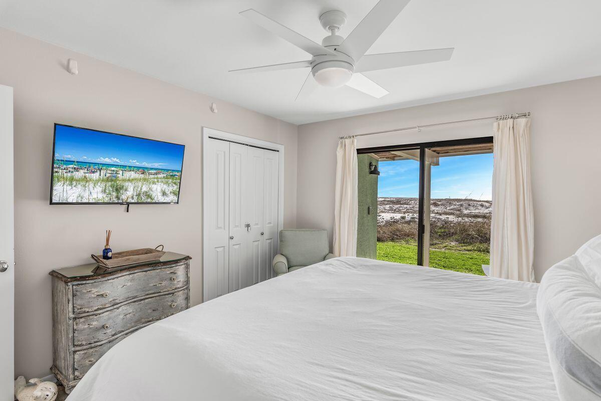 320 Gulf Shore Drive Destin, FL 32541 - Photo 21 of 46 a bedroom with a bed and a large window