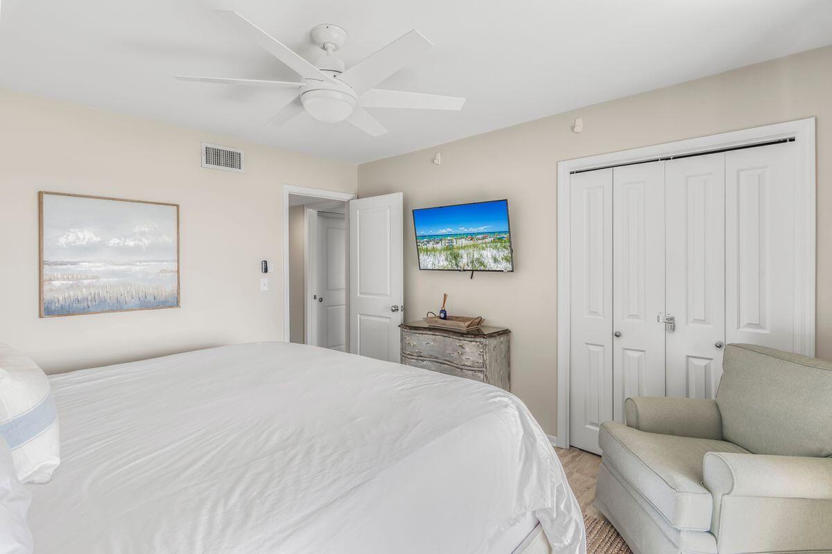 320 Gulf Shore Drive Destin, FL 32541 - Photo 22 of 46 a bedroom with a bed and a painting on the wall