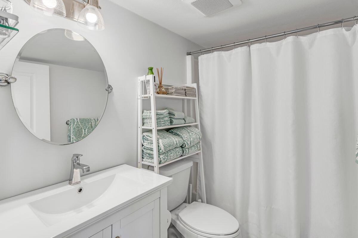 320 Gulf Shore Drive Destin, FL 32541 - Photo 23 of 46 a bathroom with a sink toilet and shower