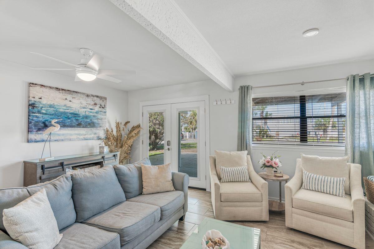 320 Gulf Shore Drive Destin, FL 32541 - Photo 26 of 46 a living room with furniture and a large window