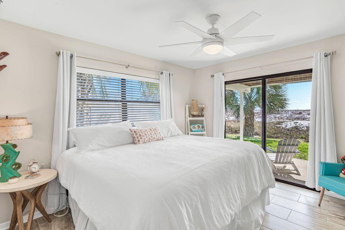 320 Gulf Shore Drive Destin, FL 32541 - Photo 28 of 46 a bedroom with a large bed and a large window
