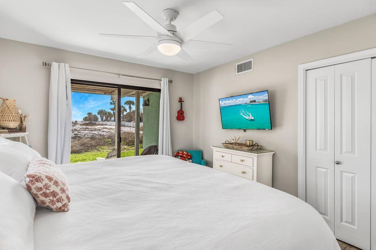 320 Gulf Shore Drive Destin, FL 32541 - Photo 29 of 46 a bedroom with a bed and a large window