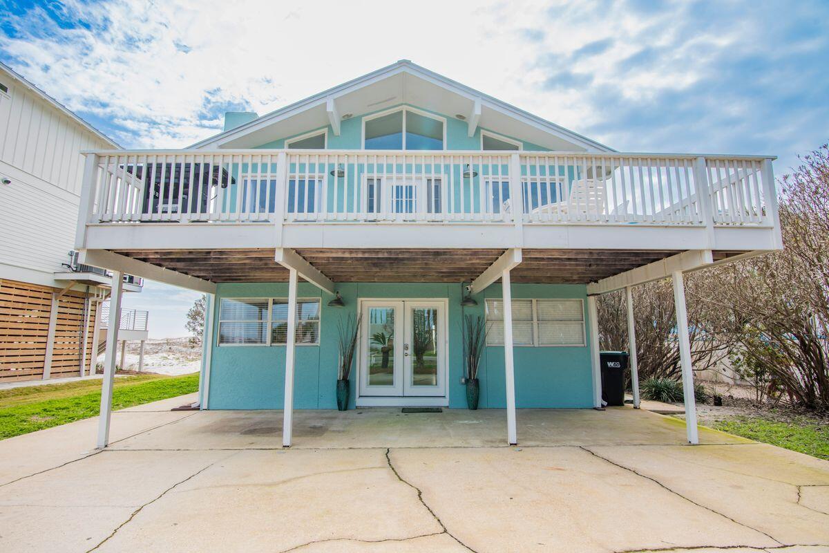 320 Gulf Shore Drive Destin, FL 32541 - Photo 3 of 46 a view of a house with a porch and furniture
