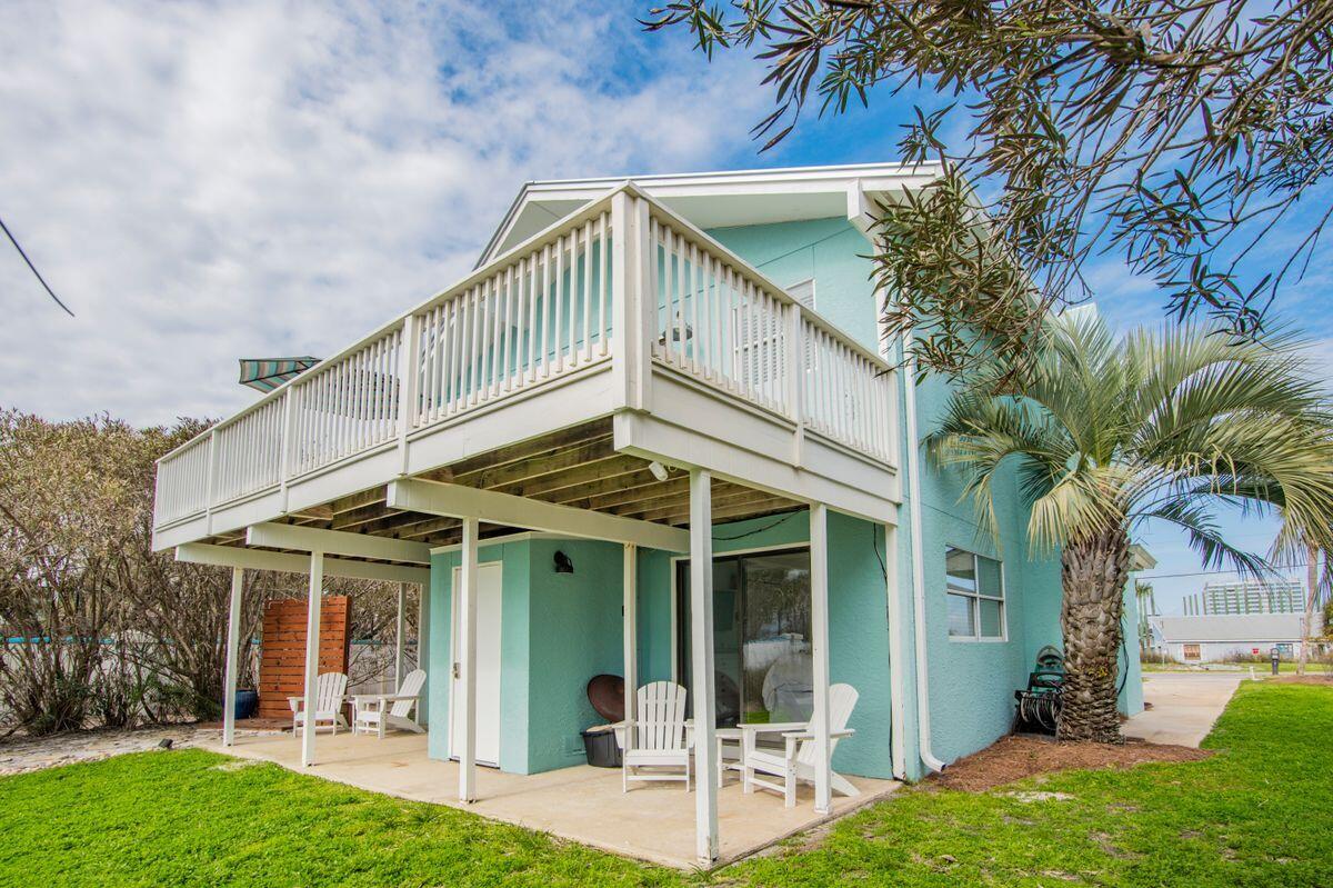 320 Gulf Shore Drive Destin, FL 32541 - Photo 37 of 46 a view of a chair and tables in the patio of a house