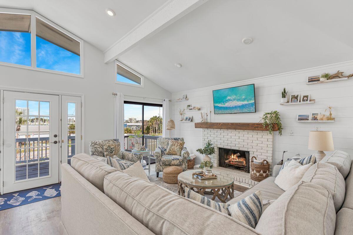 320 Gulf Shore Drive Destin, FL 32541 - Photo 7 of 46 a living room with furniture and a fireplace