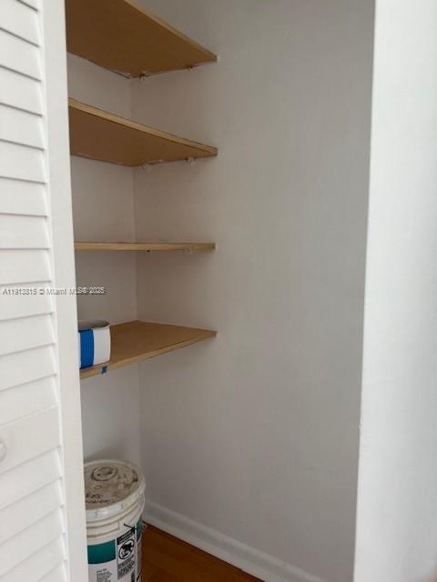 2350 Northeast 135th Street, Unit 711 North Miami, FL 33181 - Photo 5 of 10 a bathroom with a small window