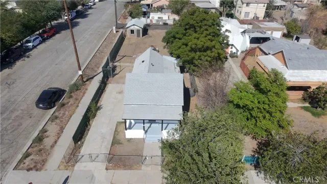 an aerial view of a house with wooden stairs