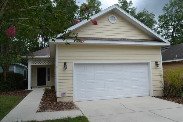 a front view of a house with a garage