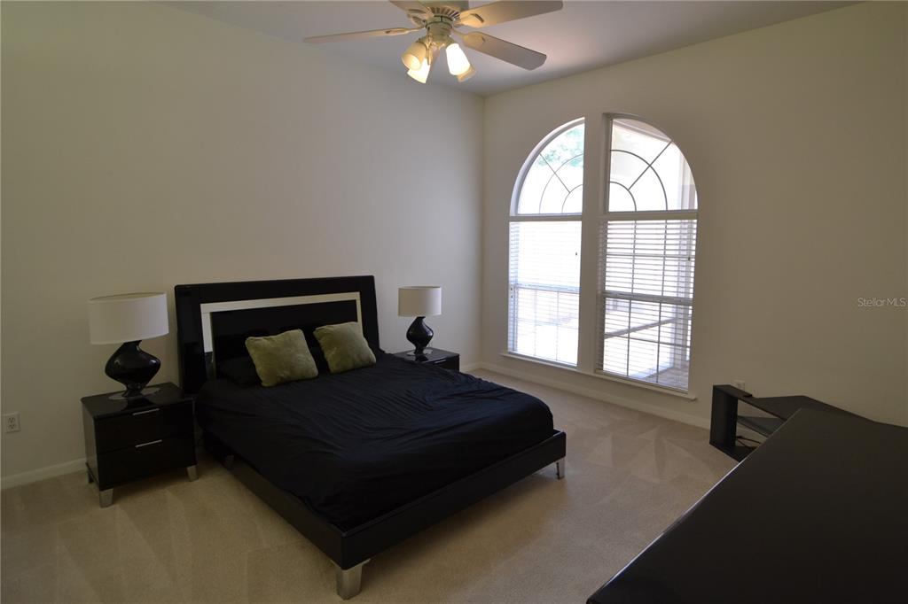 79 Northwest 48th Boulevard Gainesville, FL 32607 - Photo 20 of 30 a bedroom with a bed and window