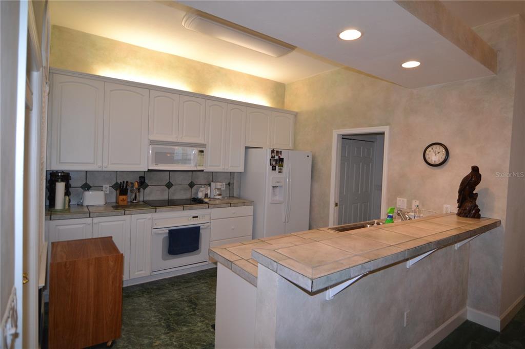 79 Northwest 48th Boulevard Gainesville, FL 32607 - Photo 23 of 30 a kitchen with a sink and cabinets
