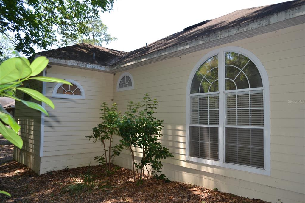 79 Northwest 48th Boulevard Gainesville, FL 32607 - Photo 29 of 30 a view of a house with a yard