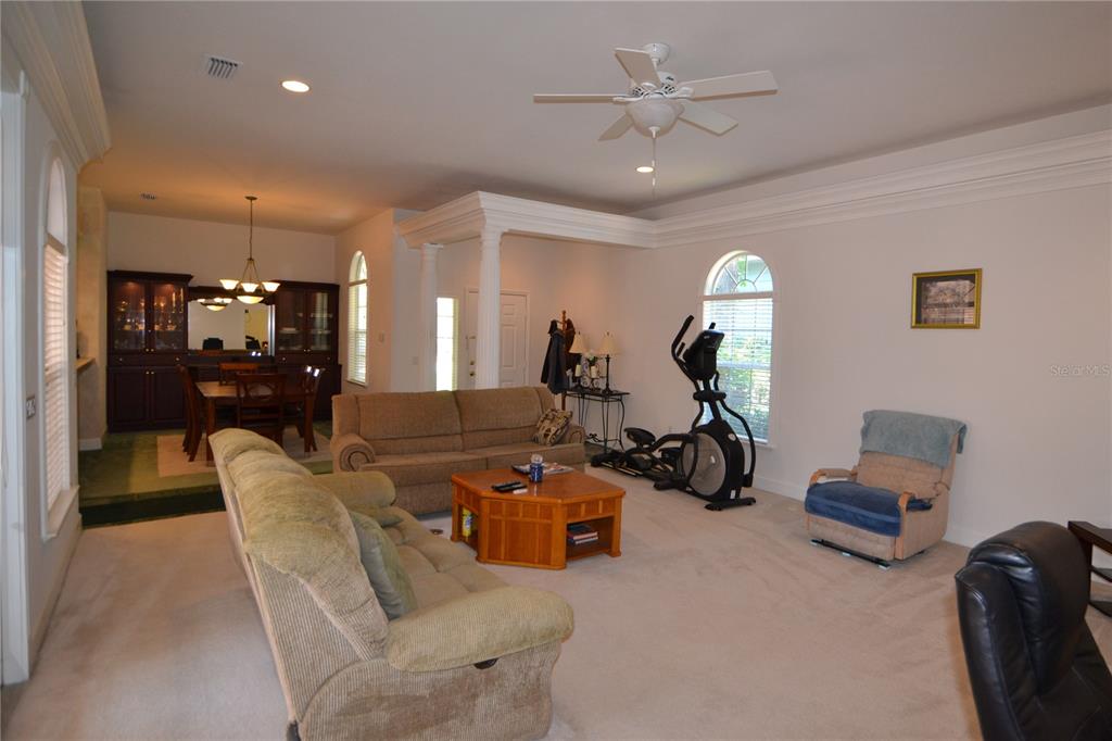 79 Northwest 48th Boulevard Gainesville, FL 32607 - Photo 9 of 30 a view of a livingroom with furniture and a gym cycle
