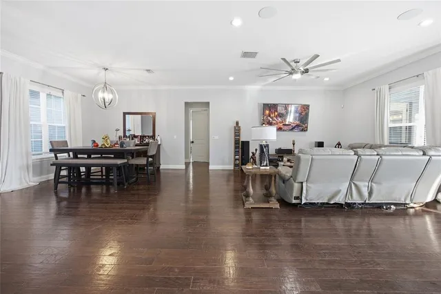 a living room with fireplace furniture and a wooden floor