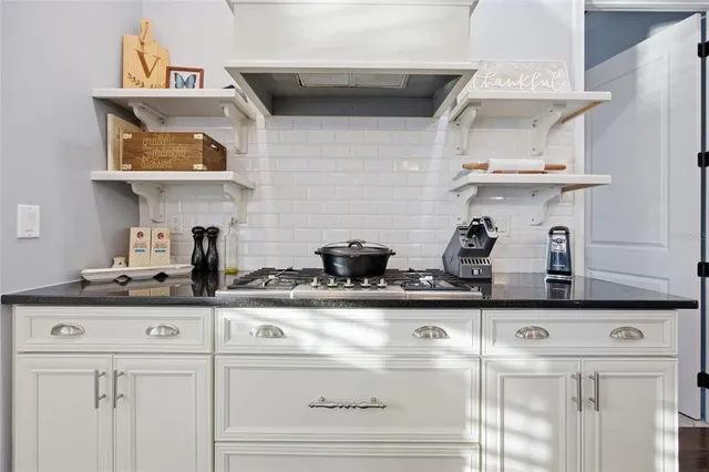 a kitchen with a cabinets and a stove