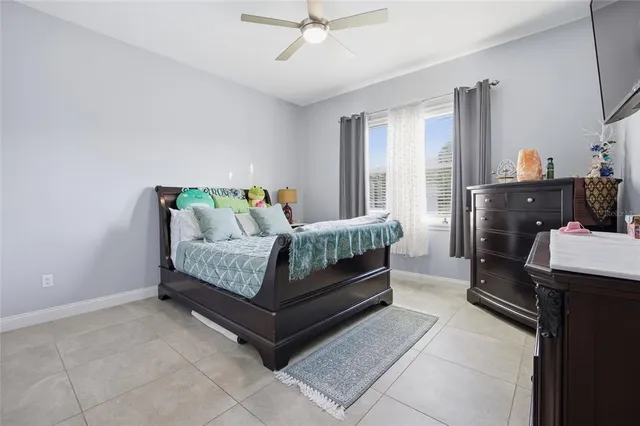 a bedroom with a bed and window