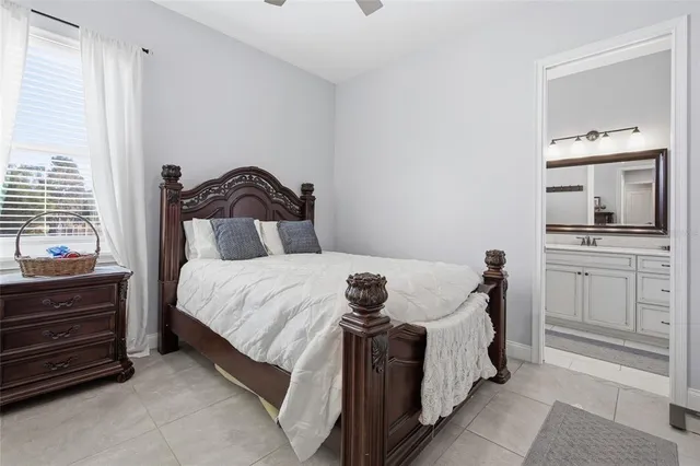 a bedroom with a bed and a mirror