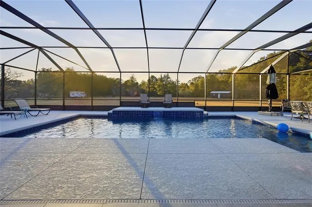 a view of a swimming pool with a patio