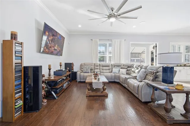a living room with furniture or couch and a wooden floor