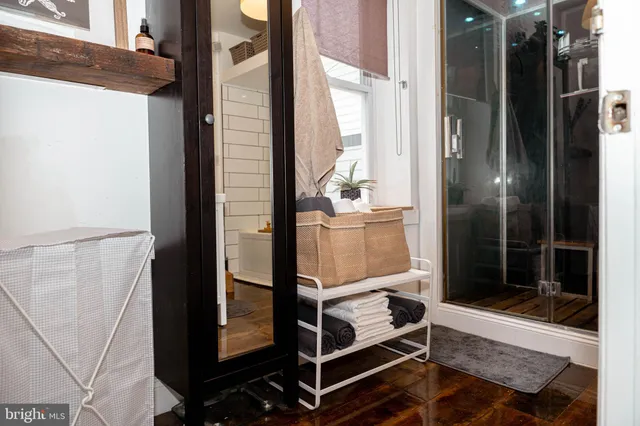 a bathroom with a tub and shower
