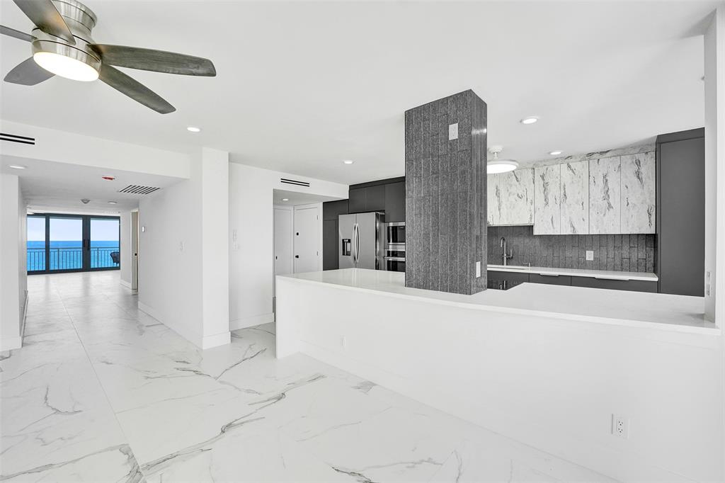 1390 South Ocean Boulevard, Unit 5C Pompano Beach, FL 33062 - Photo 13 of 35 a view of kitchen and wooden floor